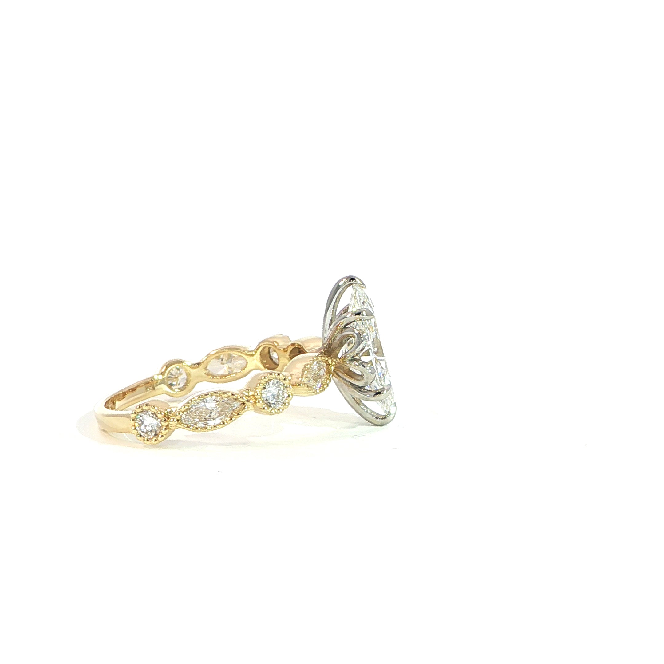 Vintage inspired marquise diamond ring with bezel accents side profile