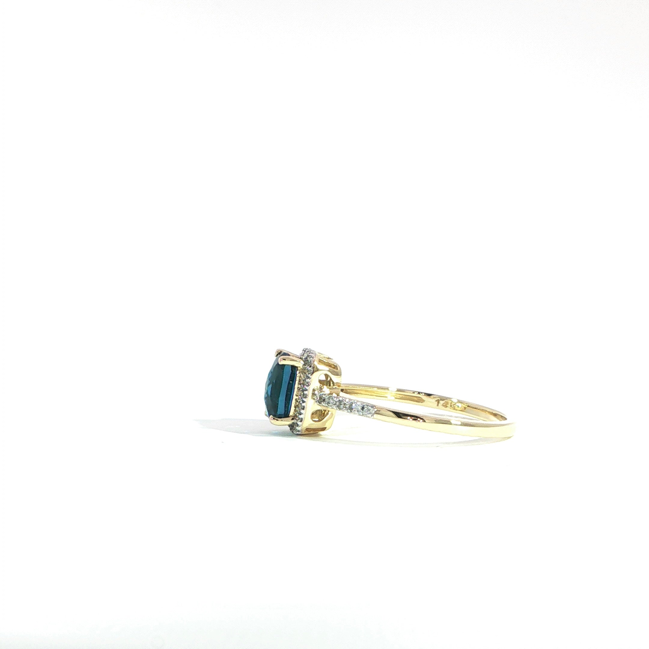 Side blue topaz ring with diamond halo