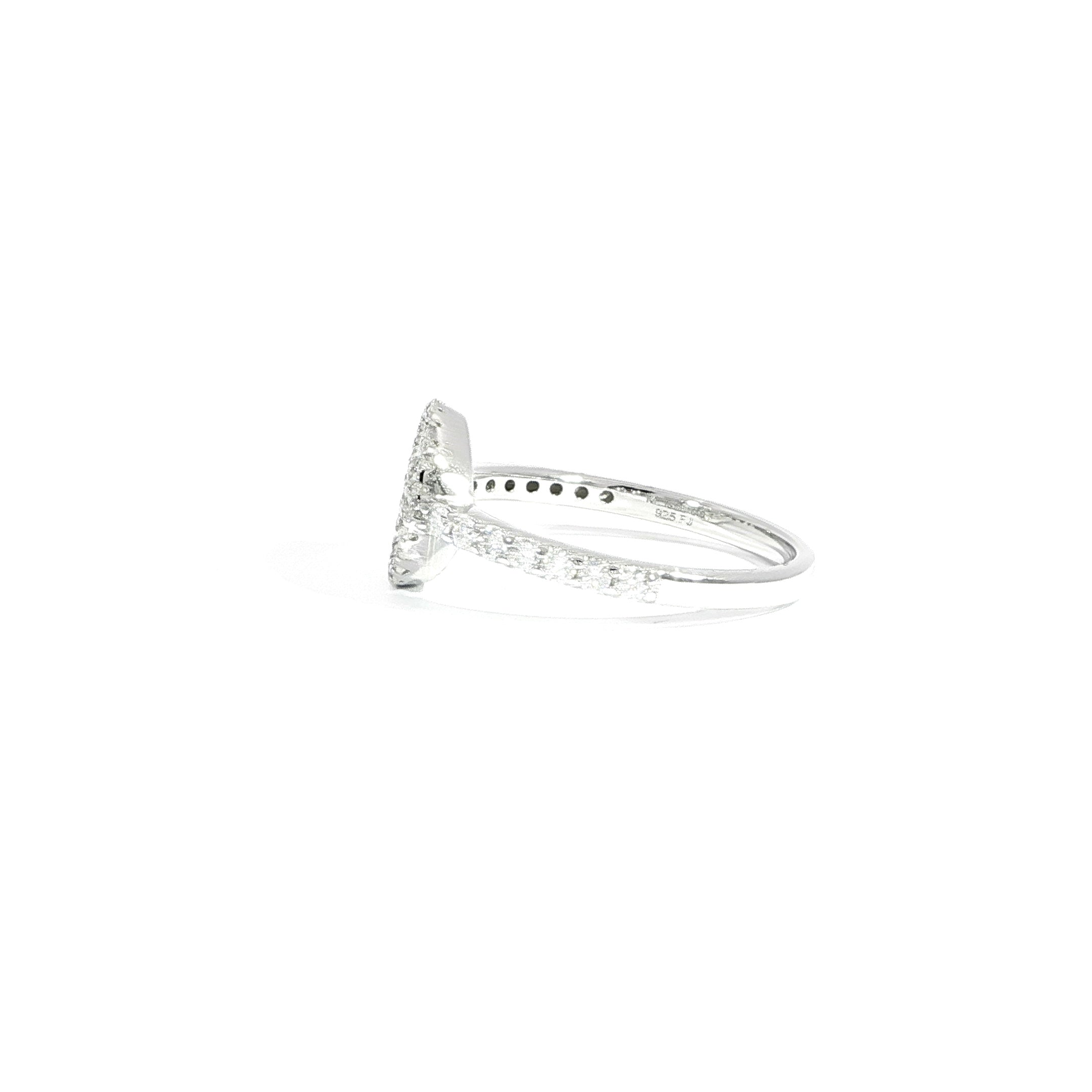 Side profile round halo ring with baguette center