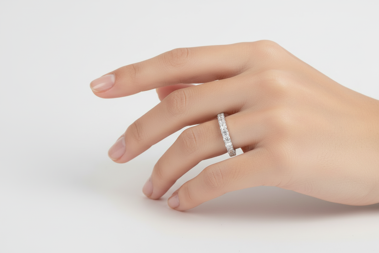 Thin silver band ring with round moissanite stones
