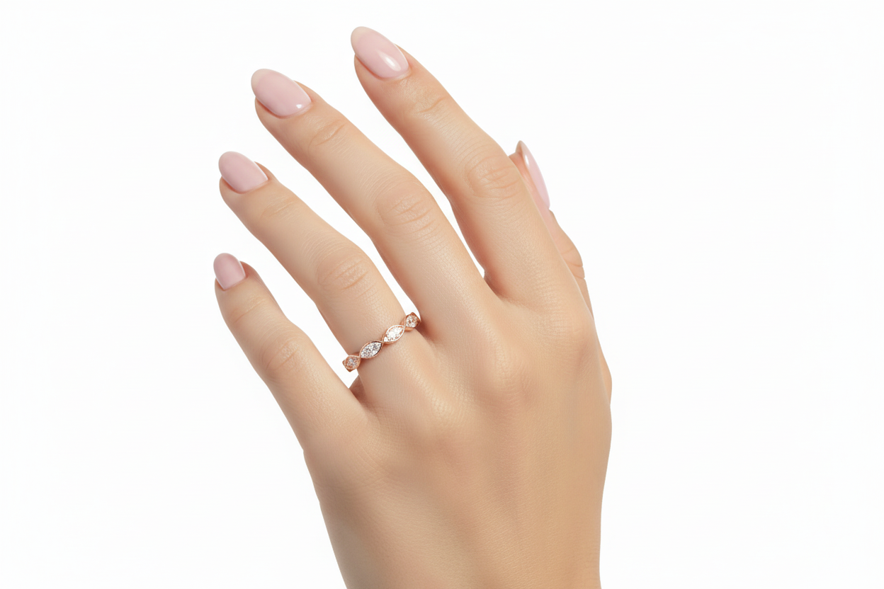 Model wearing elegant bezel set diamond band on hand