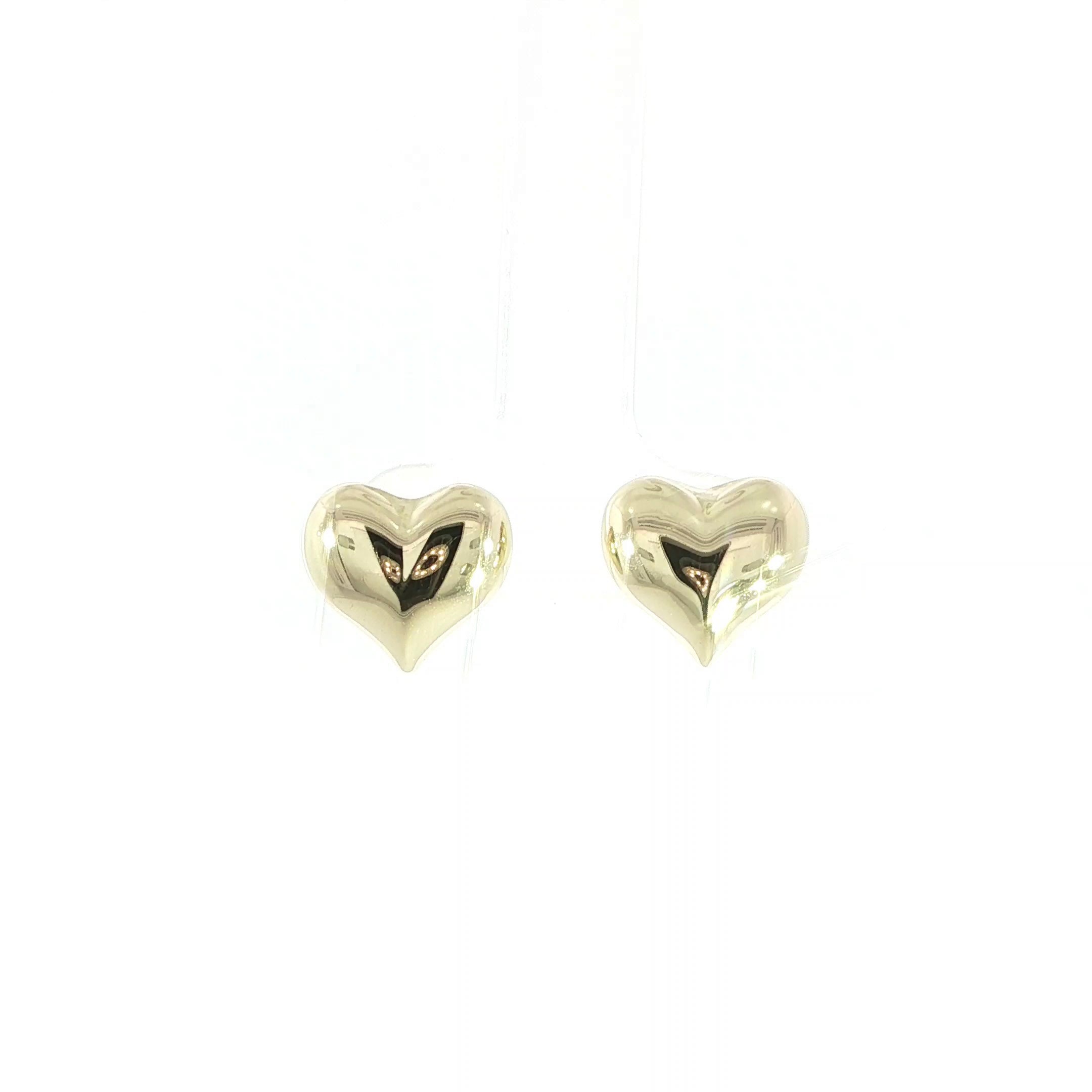 Puffy heart stud earrings crafted in solid 14K yellow gold
