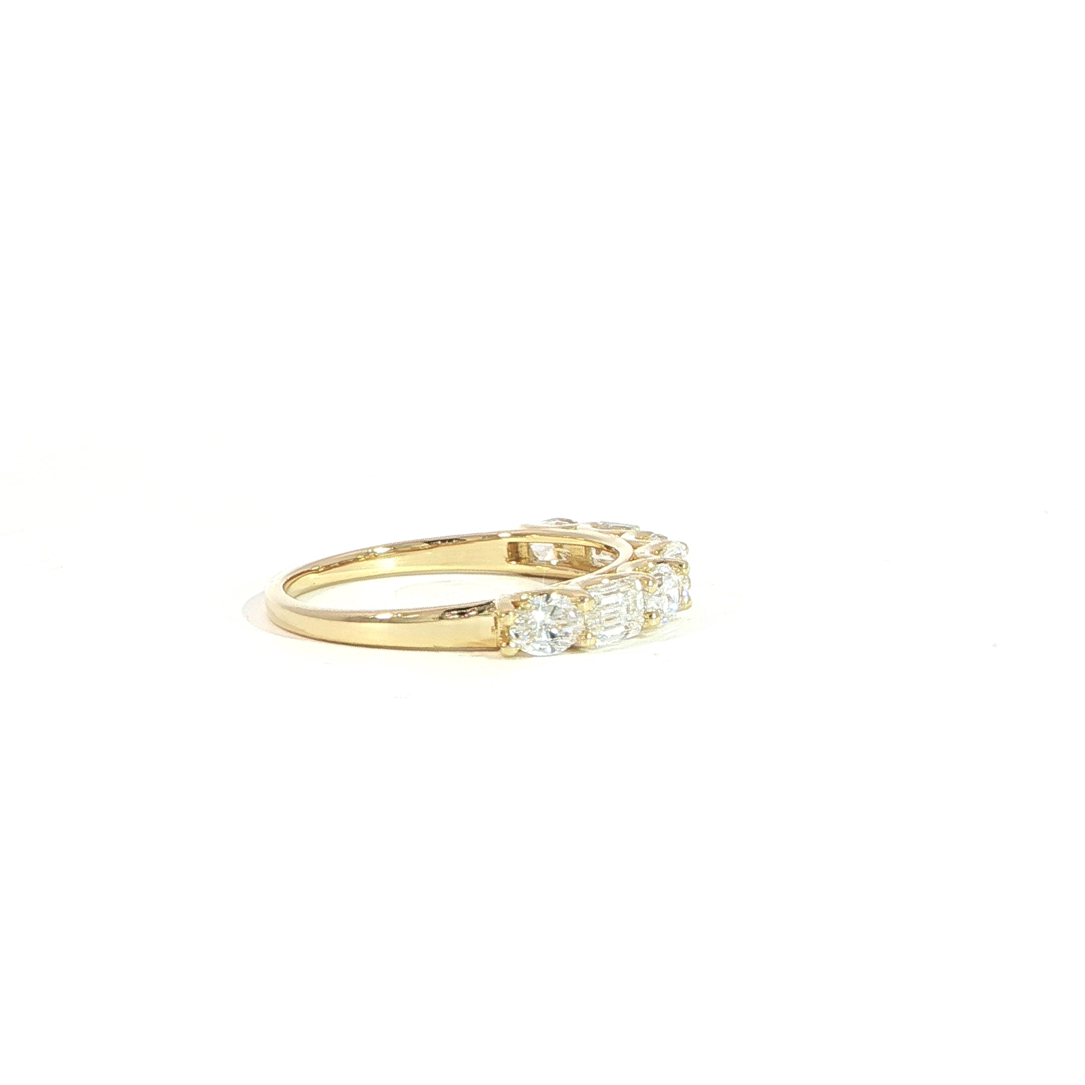 modern-emerald-oval-diamond-anniversary-band-side-view