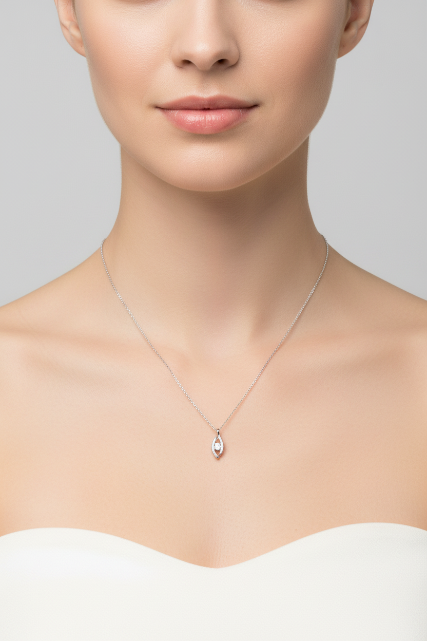 Model wearing modern floating moissanite pendant with delicate cable chain.