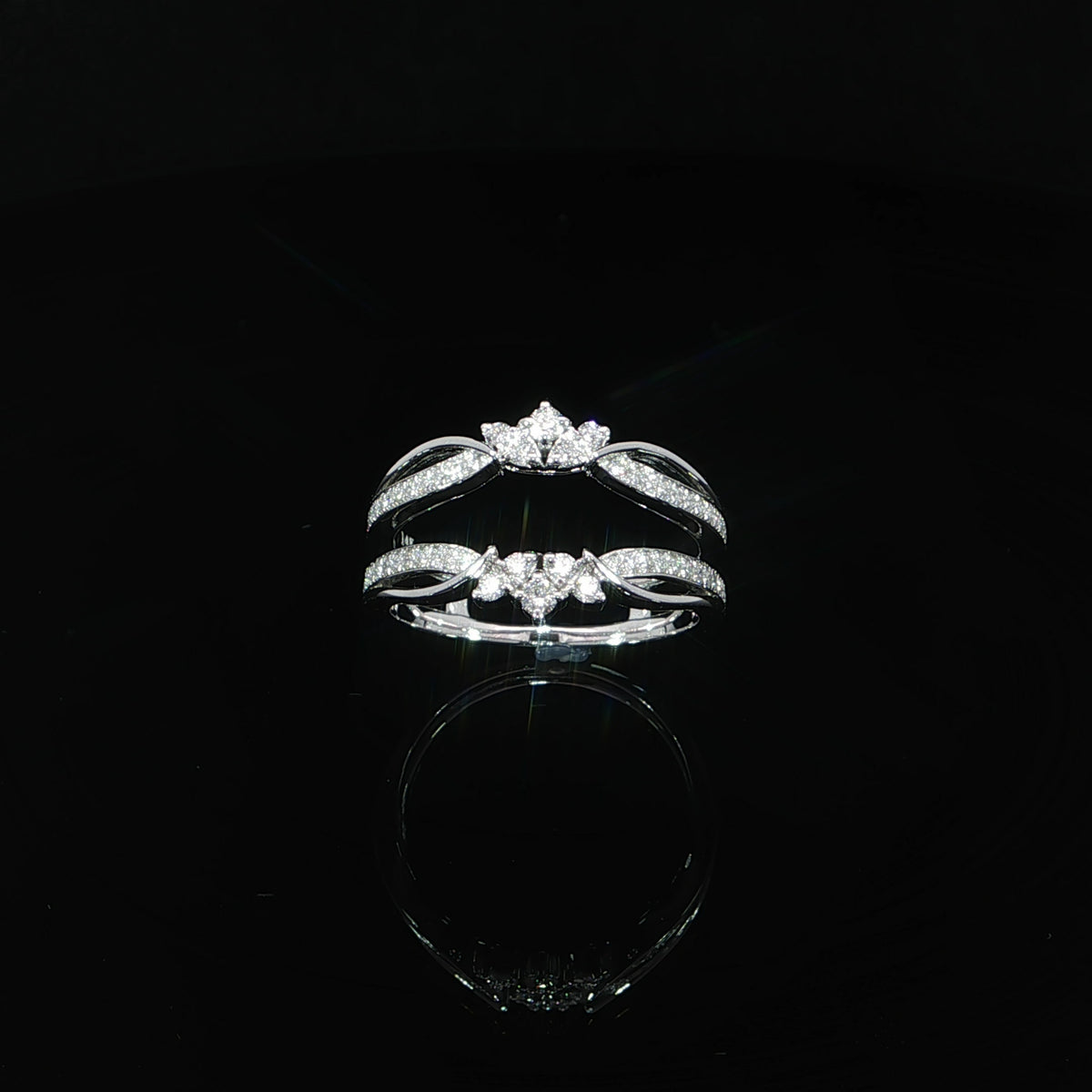 White gold floral ring enhancer showing diamond-set bands and polished looping accents