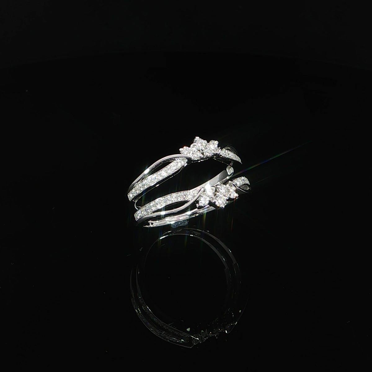 Floral diamond clusters frame the open center of a 0.38 CTW lab-grown diamond ring enhancer