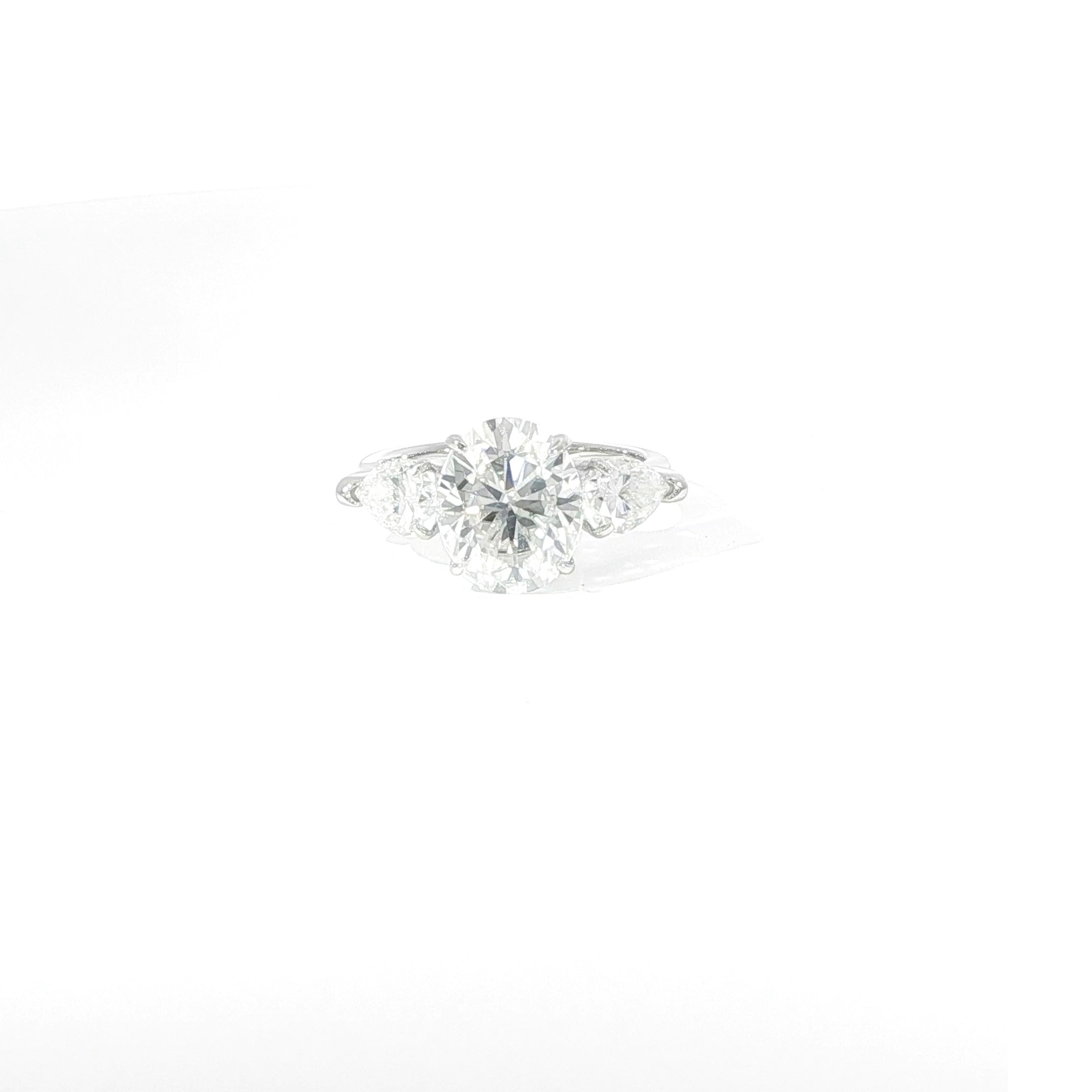 Sterling silver oval three-stone moissanite ring with pear side stones