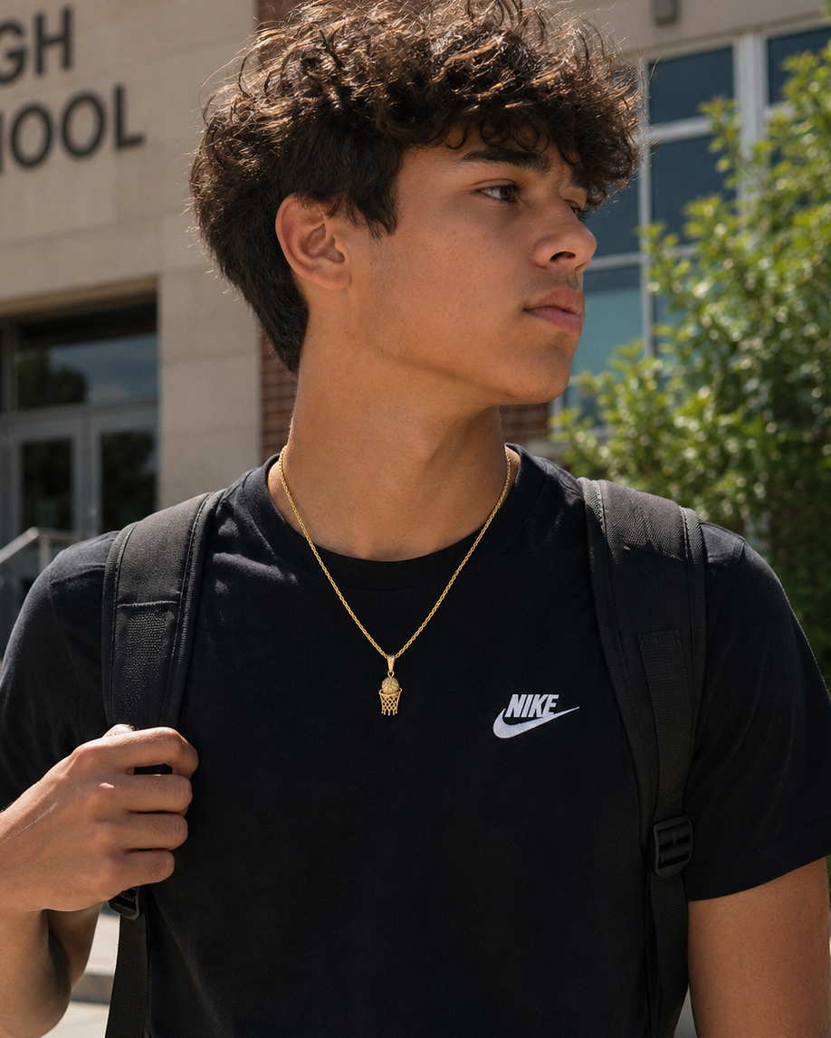 Teen wearing 10K gold sport basketball pendant outside school