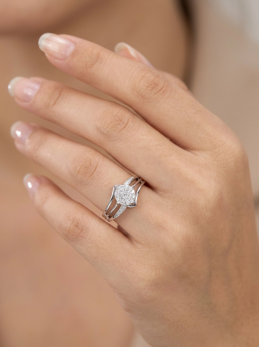 Model wearing a 10K white gold natural diamond engagement ring with 0.07 CTW and bypass design.