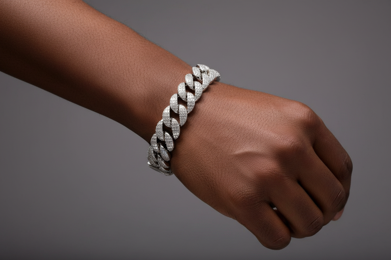 Iced-out sterling silver Miami Cuban link bracelet with VVS moissanite baguette accents and round pavé diamonds look.