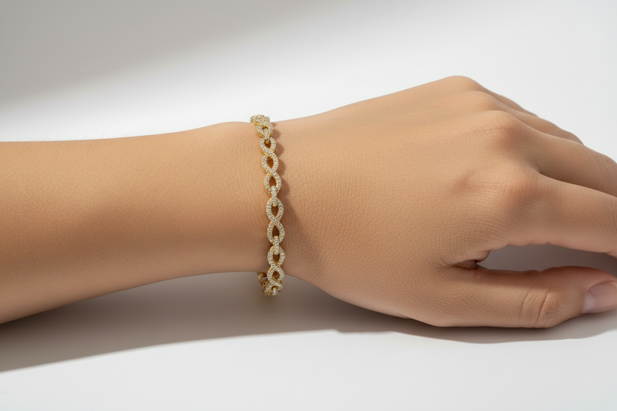 Elegant infinity bracelet crafted in 925 sterling silver with brilliant VVS moissanite accents.