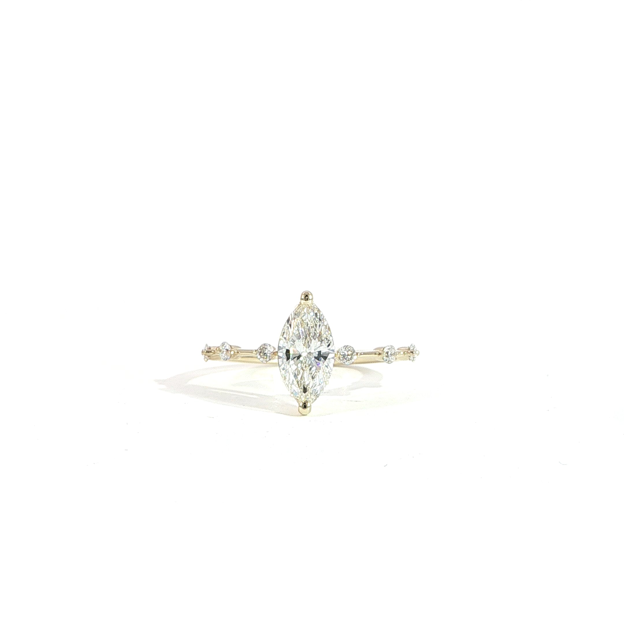 Marquise 1 carat lab diamond engagement ring with station band in 14K gold front