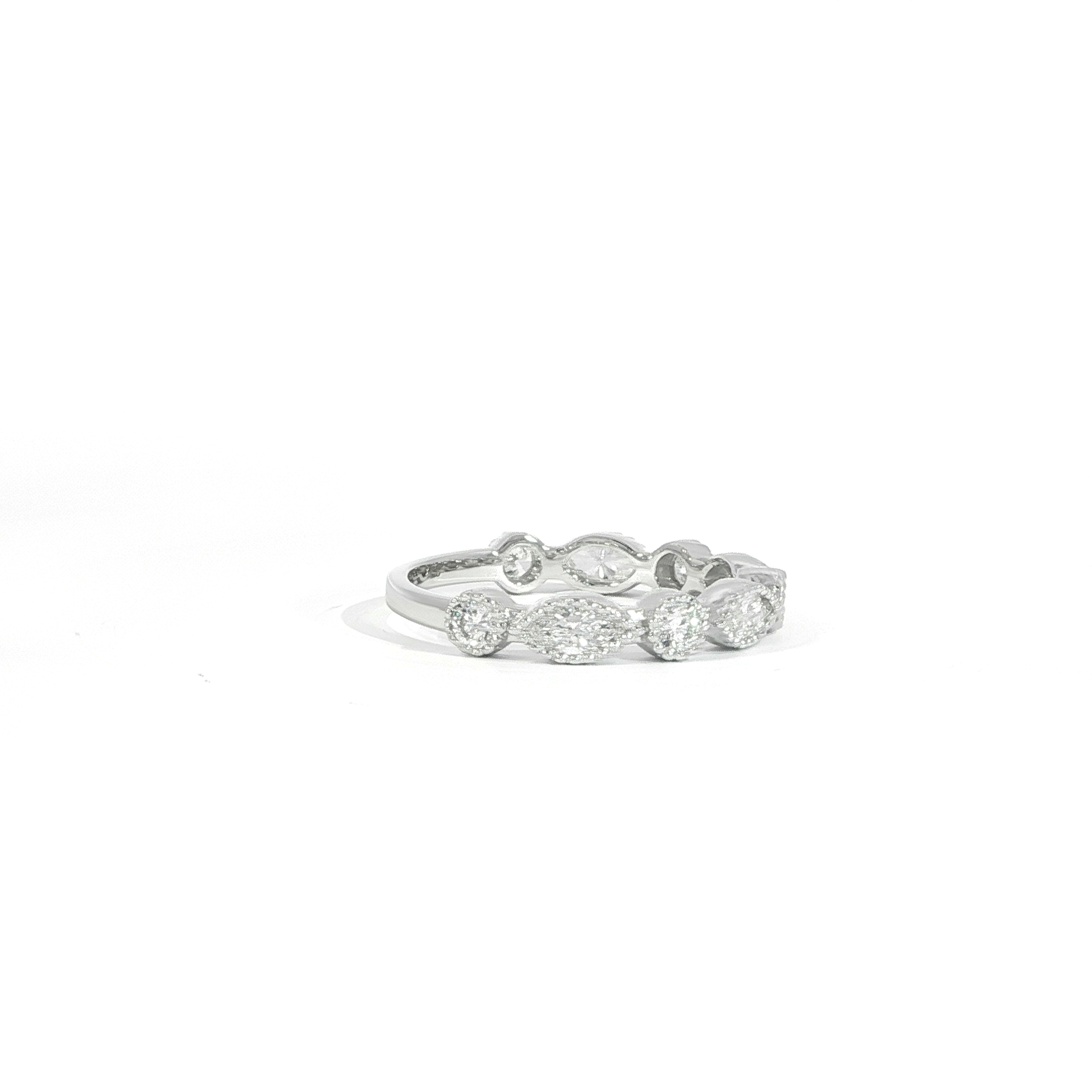 Side view of vintage diamond band with milgrain detail