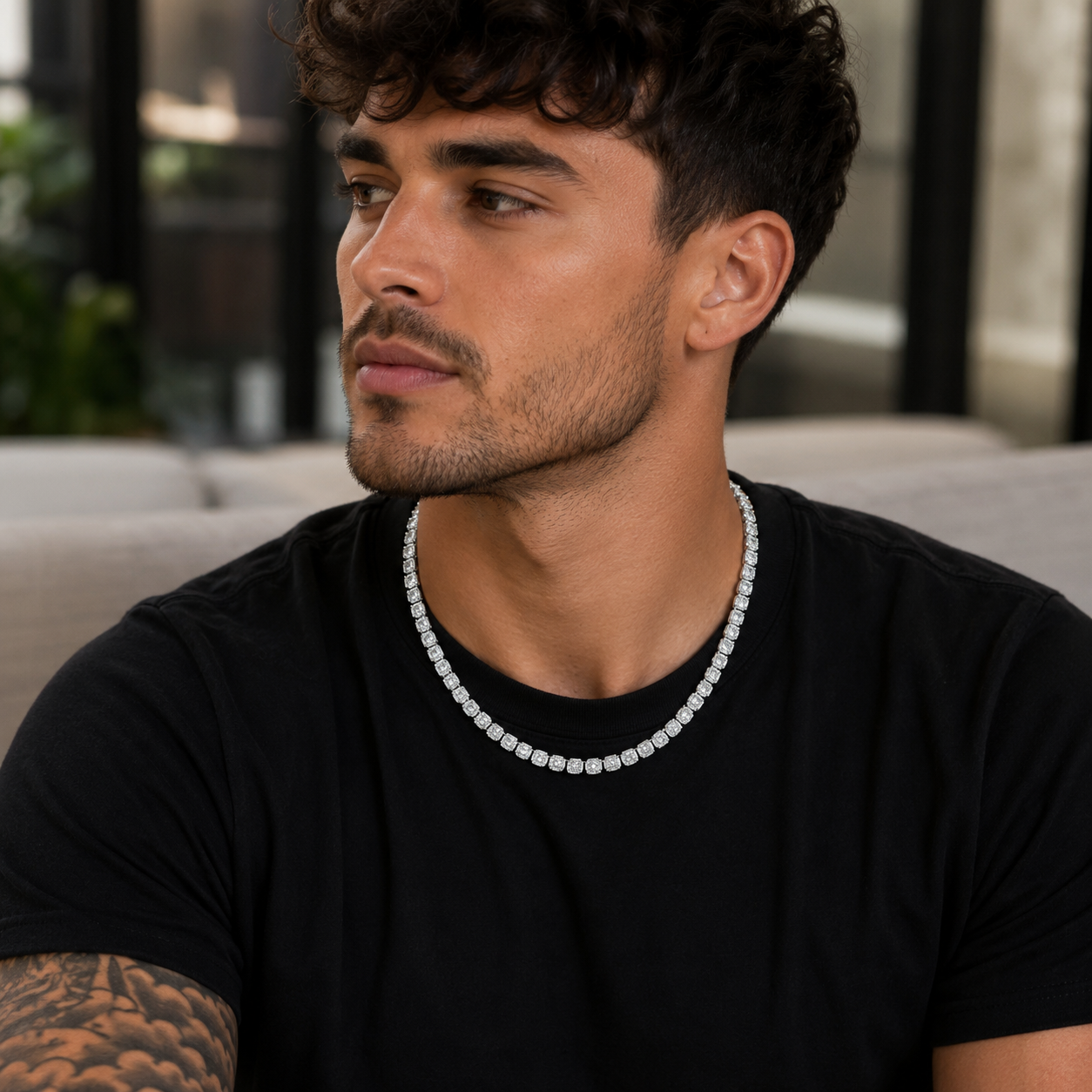 Model wearing 6MM sterling silver halo tennis chain with 15.66 CTW princess cut moissanite.