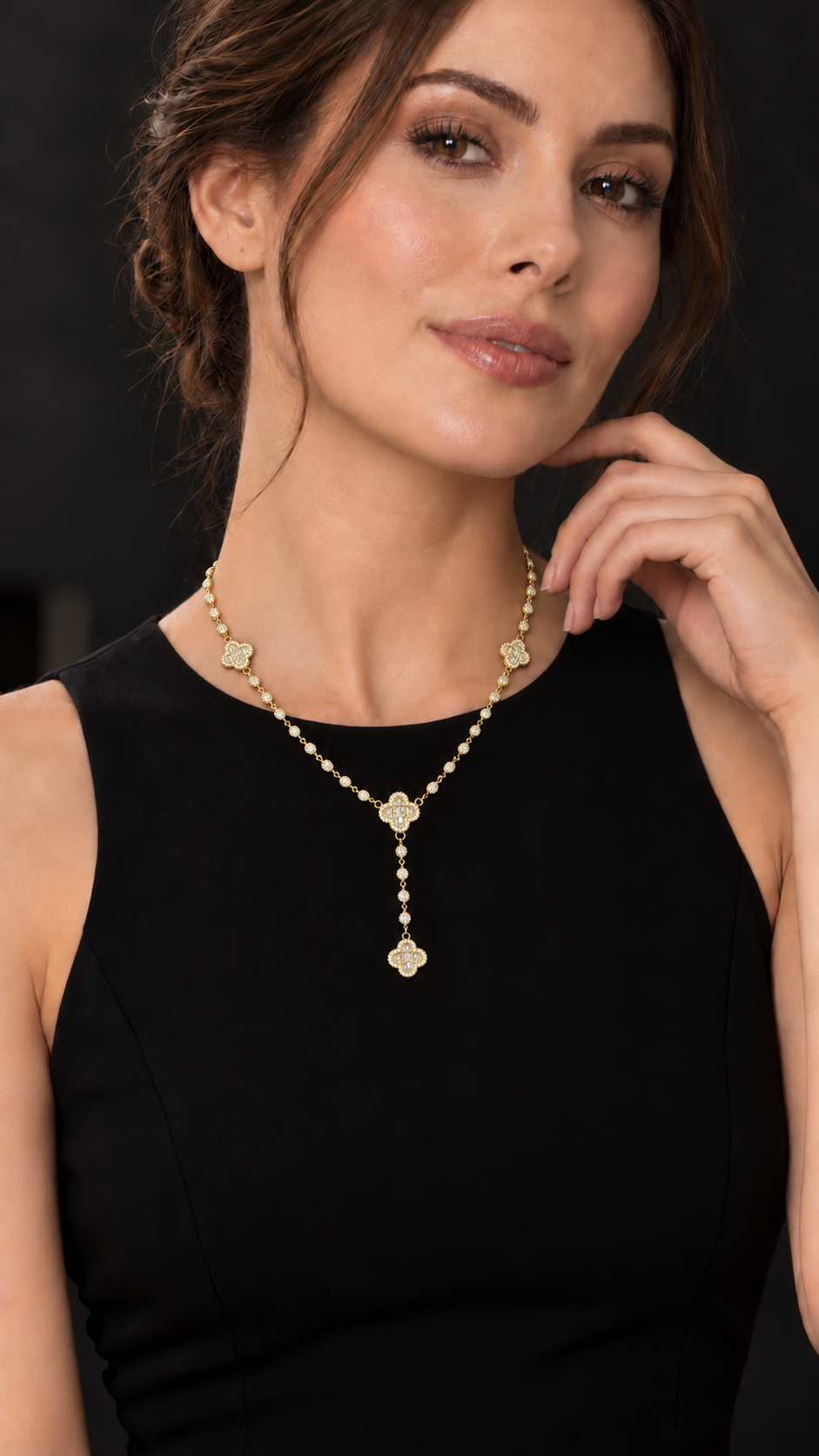 Model wearing designer-inspired clover lariat necklace in sterling silver with 15CTW VVS Moissanite.