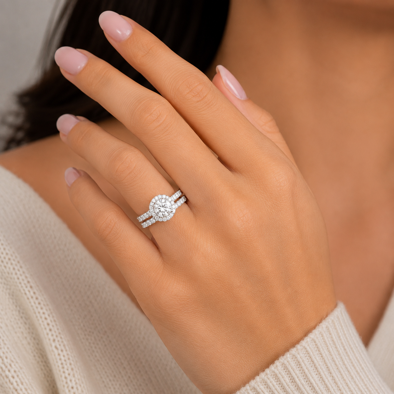 Model wearing moissanite bridal ring set in sterling silver