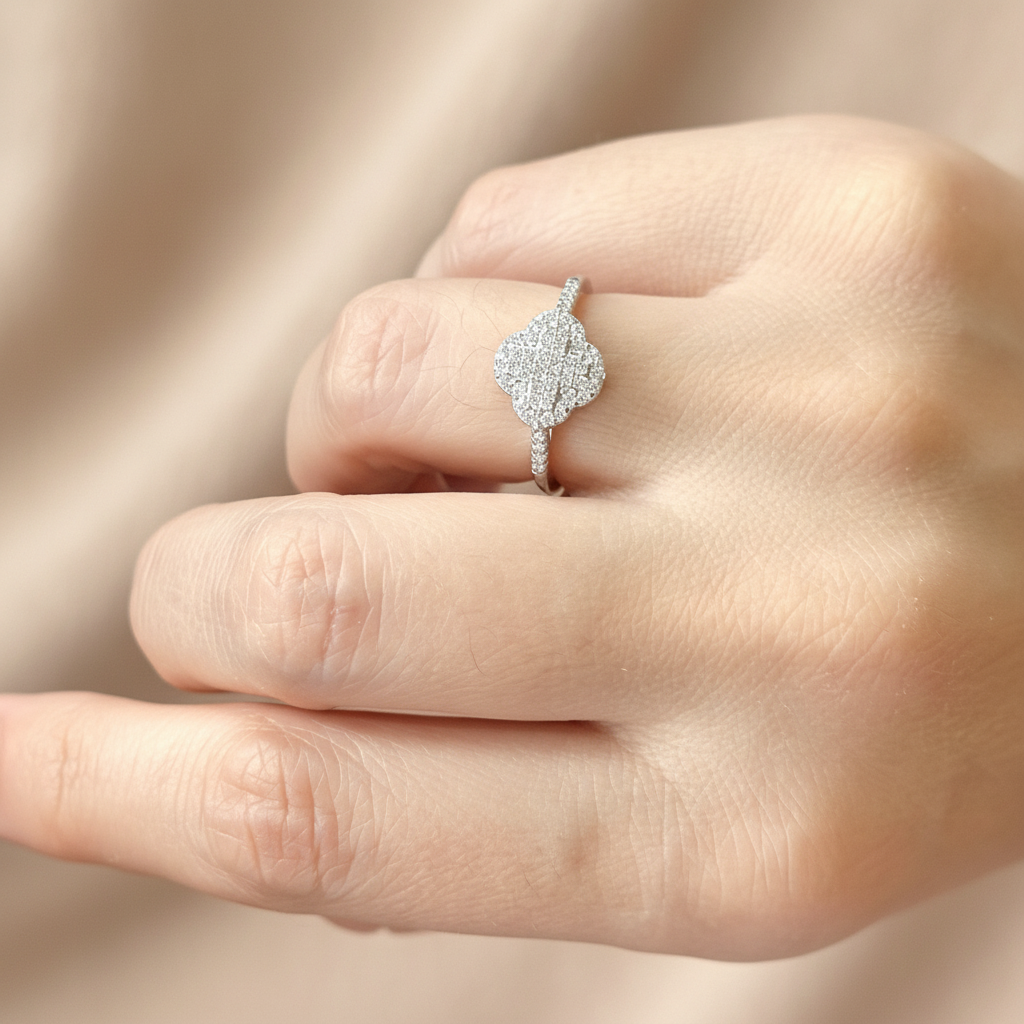 Delicate silver clover ring with brilliant moissanite stones