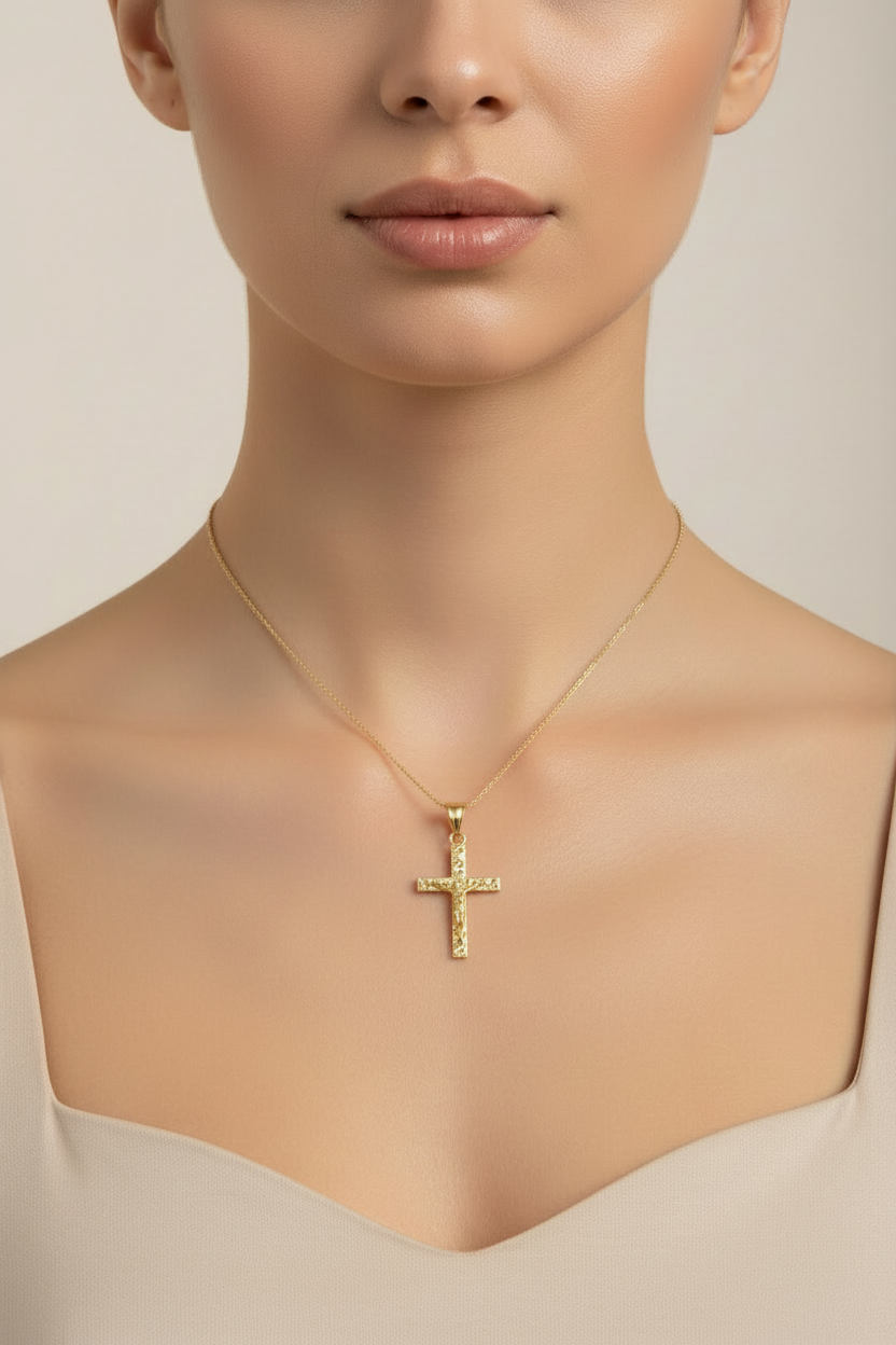 Traditional yellow gold Jesus crucifix pendant with textured detailing.