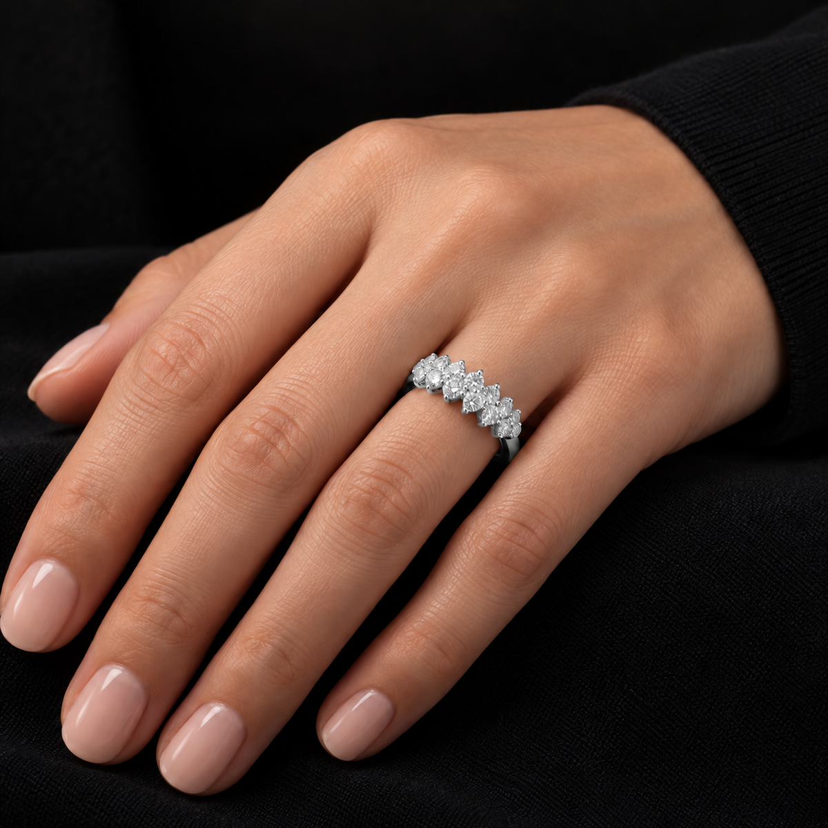 Model wearing a 14k white gold multi-stone lab grown diamond band