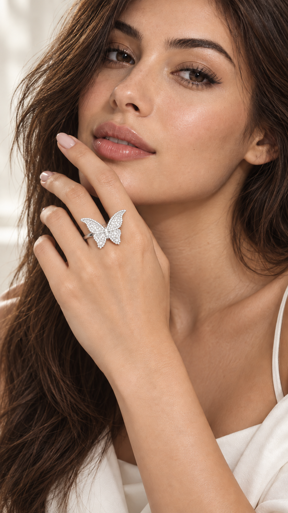 Model wearing moissanite butterfly statement ring featuring 0.88 CTW in sterling silver
