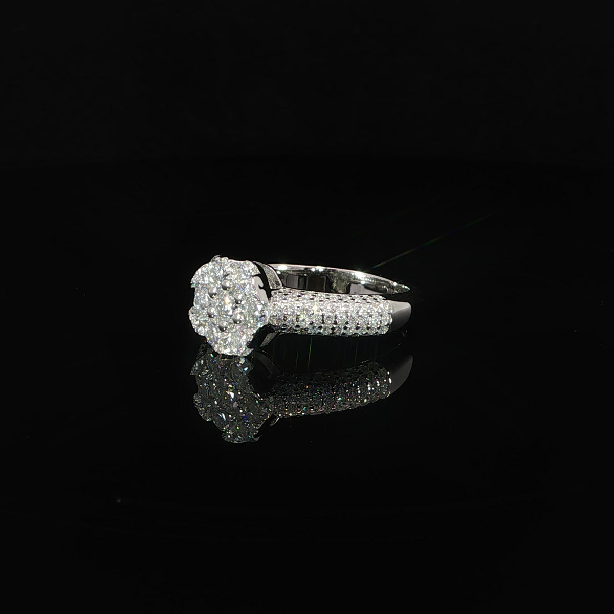 Detailed view of multiple rows of round moissanite forming the ring’s central cluster.
