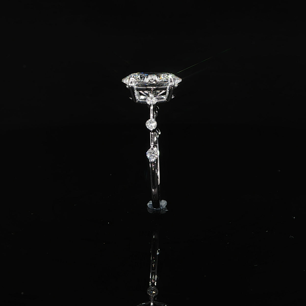 Oval engagement ring with 2.15 total carats of diamonds set in polished 14K gold.