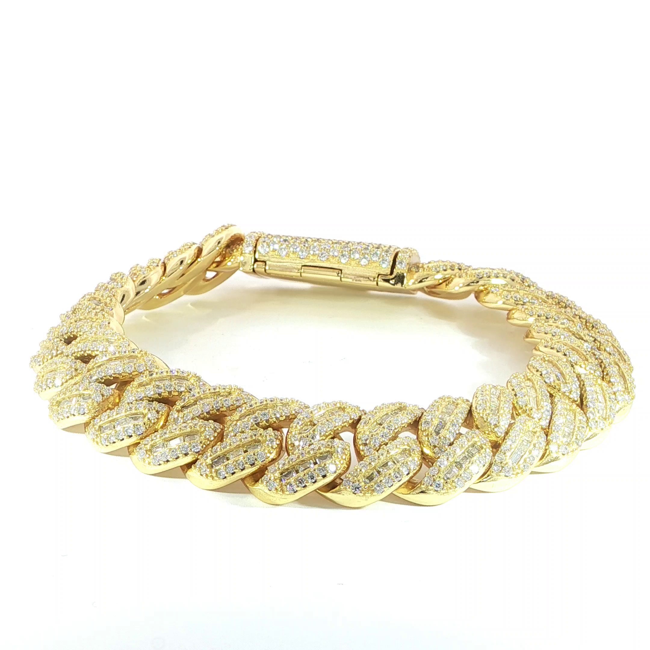 Hip hop style gold plated Cuban bracelet featuring 12 carats total weight of VVS moissanite.