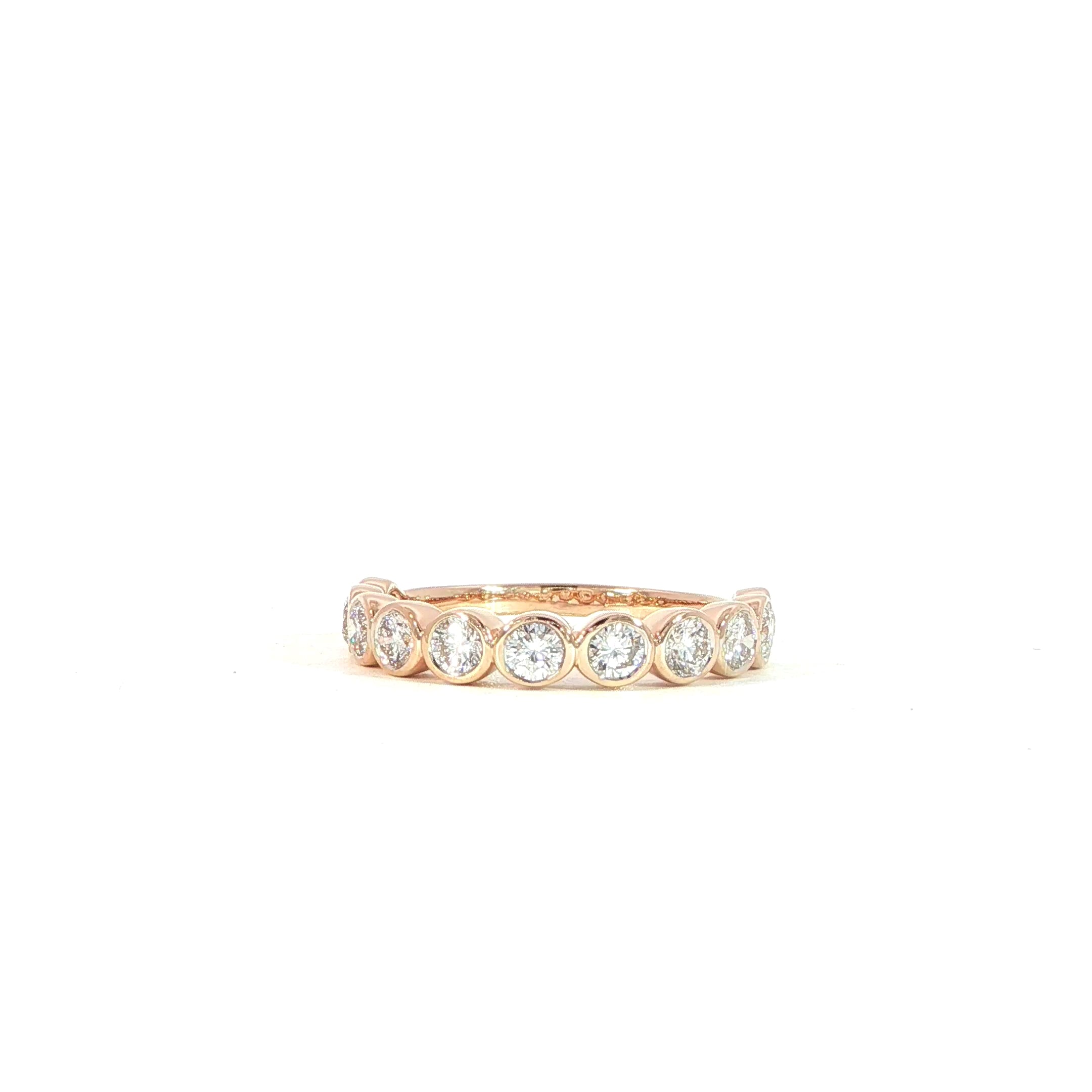 Close-up 360 video of bezel set diamond band with round diamonds in 14K rose gold