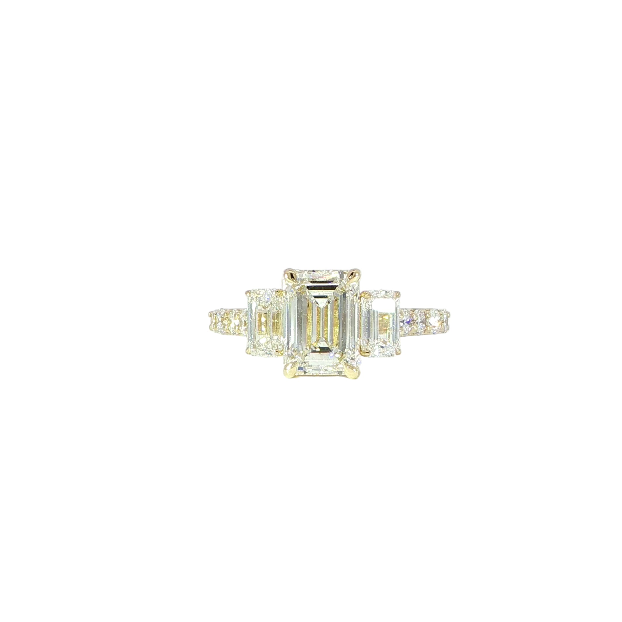 Video of 14K gold diamond ring featuring emerald cut center stone