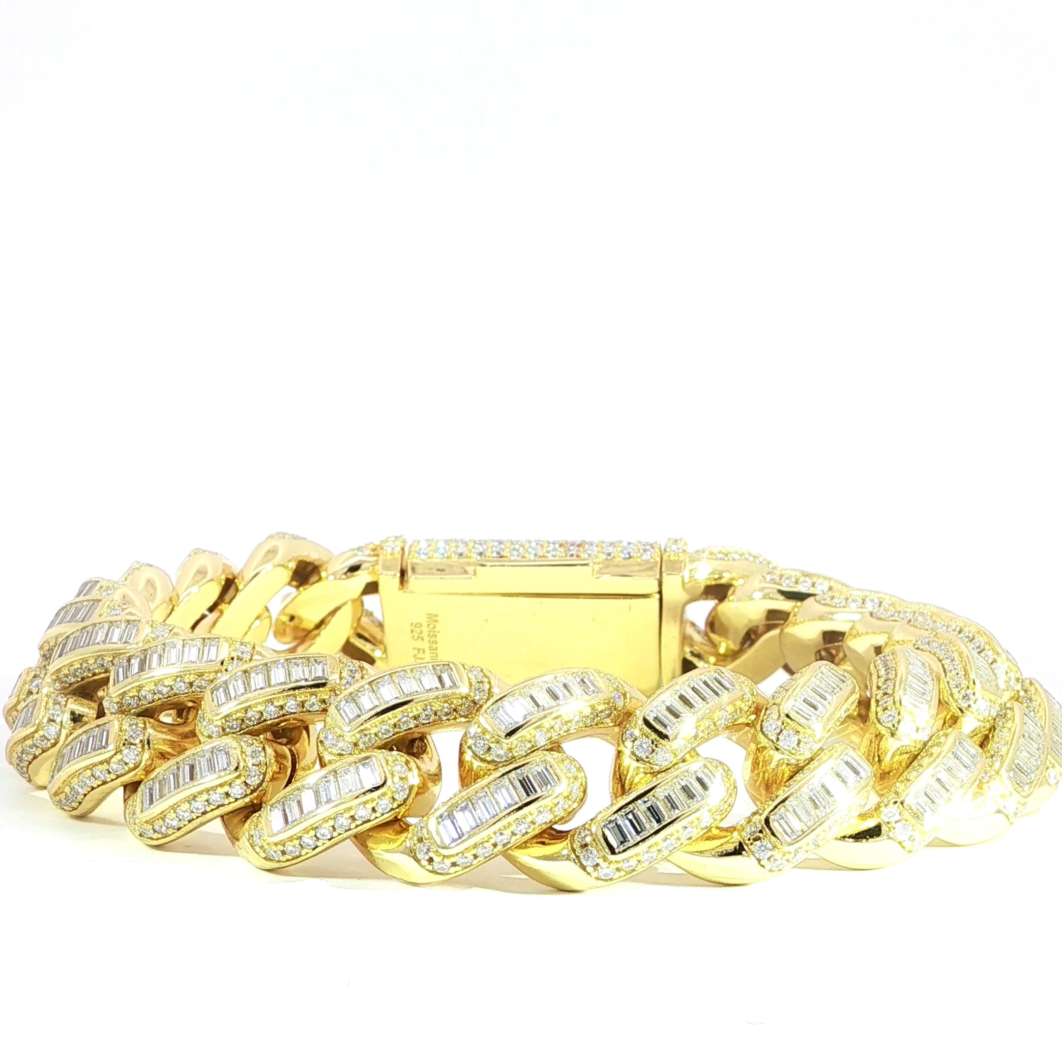Video 16MM iced out Miami Cuban bracelet with baguette center links in sterling silver.
