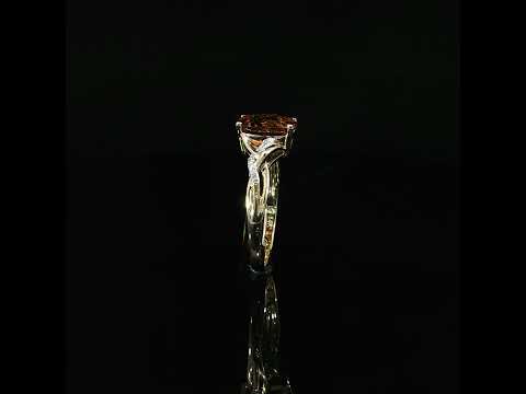 14K yellow gold oval citrine ring with 0.06 CTW diamonds, tilted above its reflection on black.