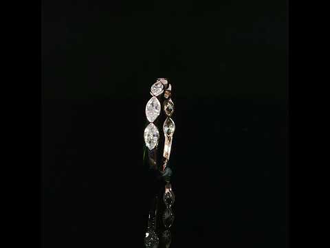 Upright marquise diamond band showing raised bezel sides and the plain polished rose gold lower shank.
