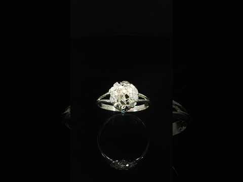 Yellow gold round nugget ring featuring uneven reflective shapes separated by finely textured channels.
