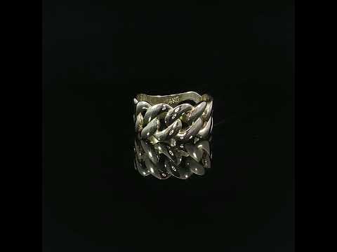 14K yellow gold Cuban link ring displayed on a glossy black background, showcasing its 9.5mm wide interlocking chain design and polished finish.