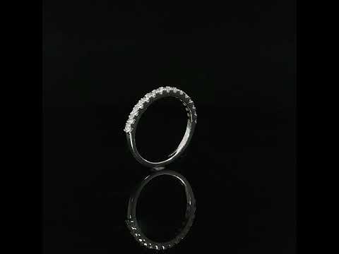 Upright view showing the diamond-set upper section meeting the polished shoulder of a white gold band.