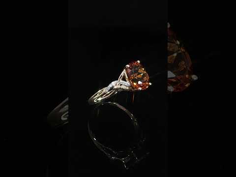 Upright side view of a 14K yellow gold citrine ring showing its open twist band and 0.06 CTW diamonds.