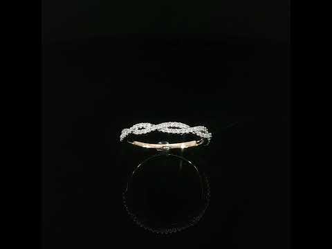 Angled view of a 14K rose gold infinity-inspired twist ring accented with 0.23 CTW sparkling lab grown diamonds.