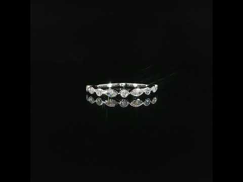 Front view of a 0.41 CTW lab-grown diamond band in 14K white gold on a reflective black surface.