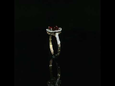 Video showing the scalloped halo and diamond band of a 14K yellow gold garnet ring, 0.10 CTW.