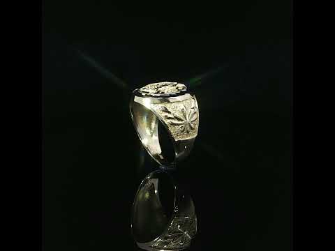Centenario-inspired signet ring with a faceted white accent rim and sculpted shoulder decoration.