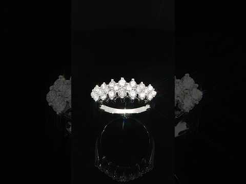 Angled detail of a 14K yellow gold anniversary ring with lab-grown diamonds arranged across the top.