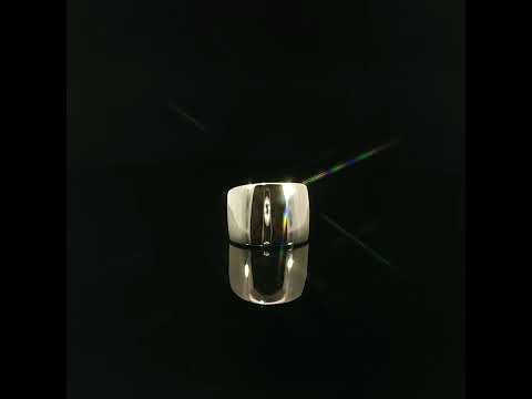 Wide 14K yellow gold dome ring with a smooth, reflective surface