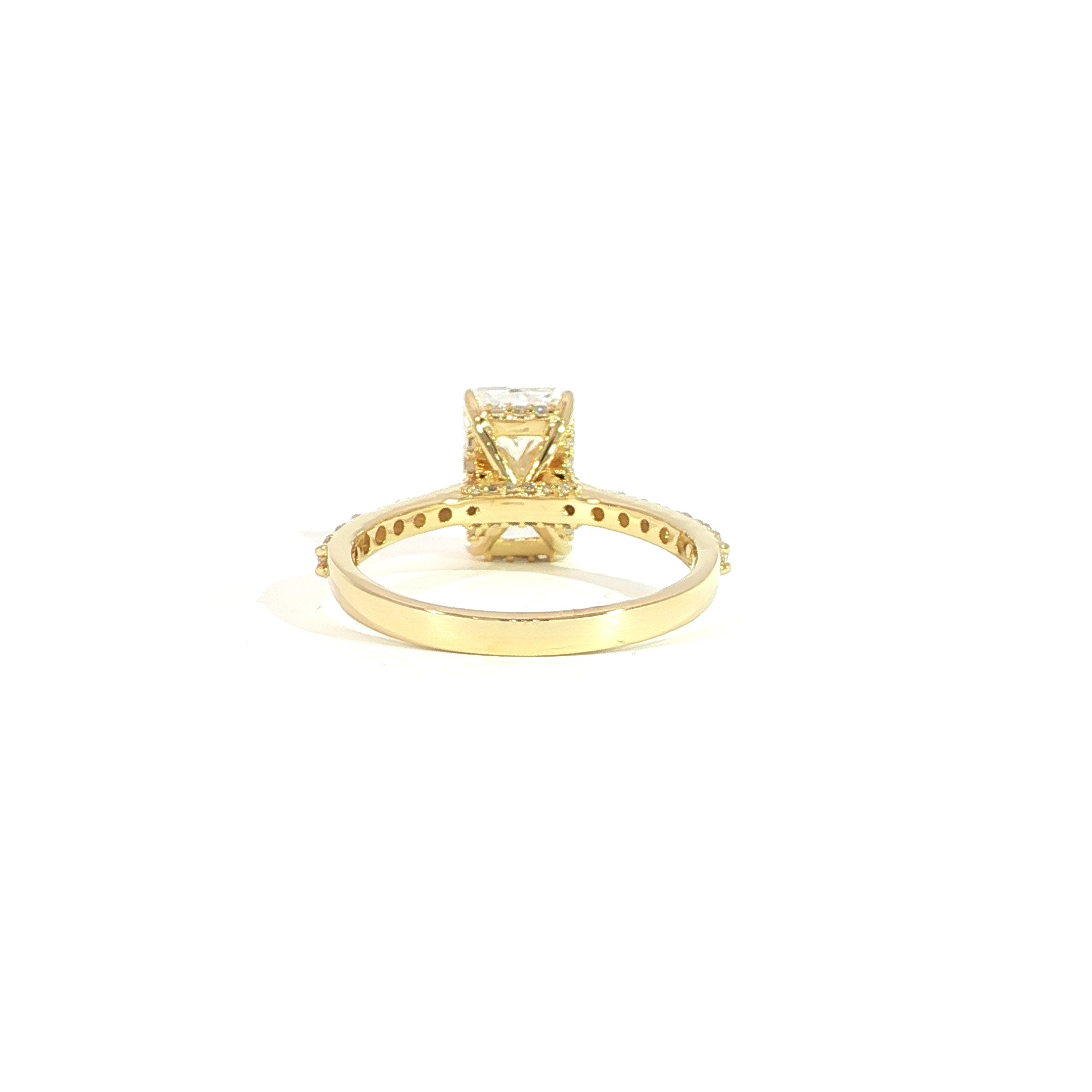 Back view of radiant diamond ring with pavé-set band in 14K yellow gold