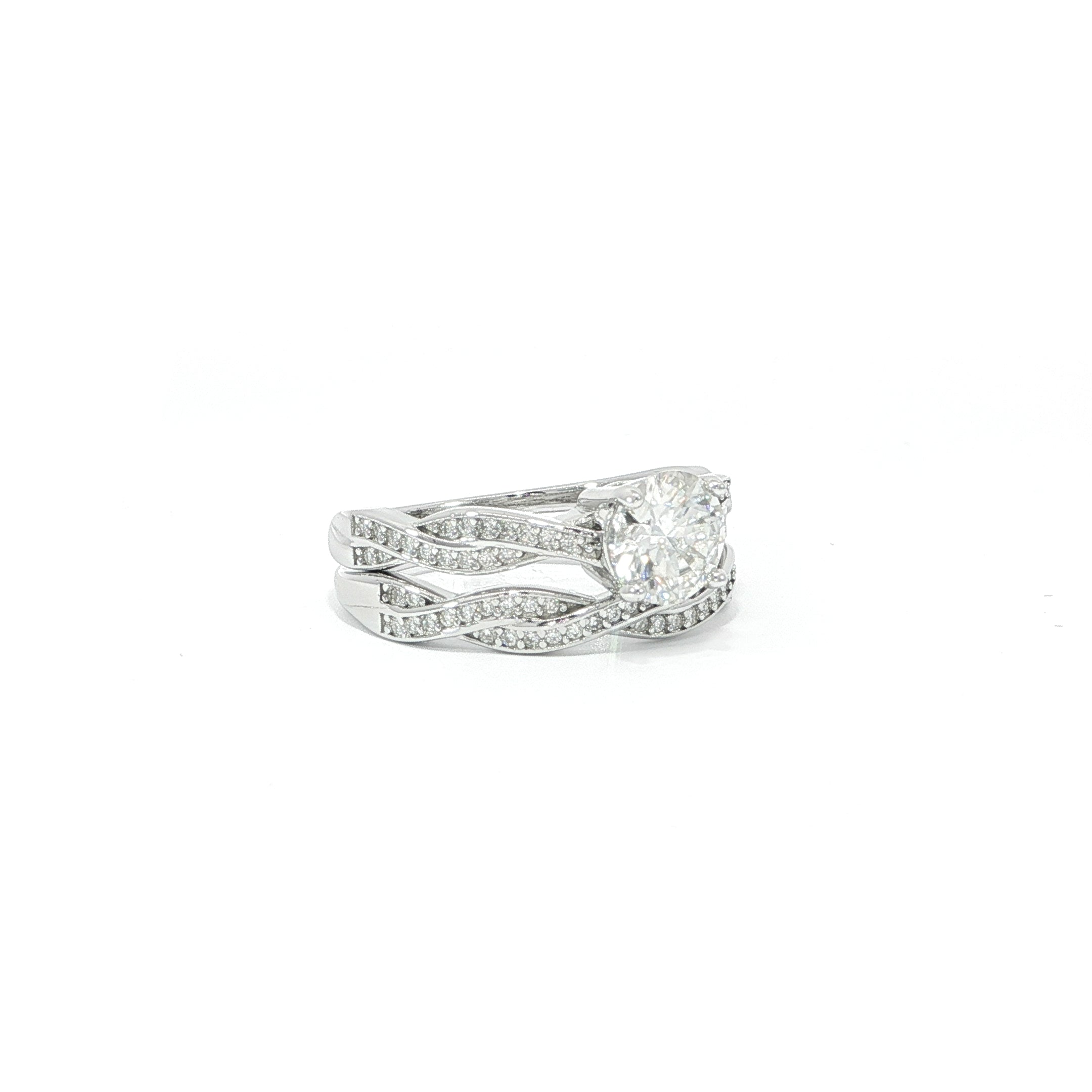 Round moissanite wedding ring set with infinity-inspired pavé bands