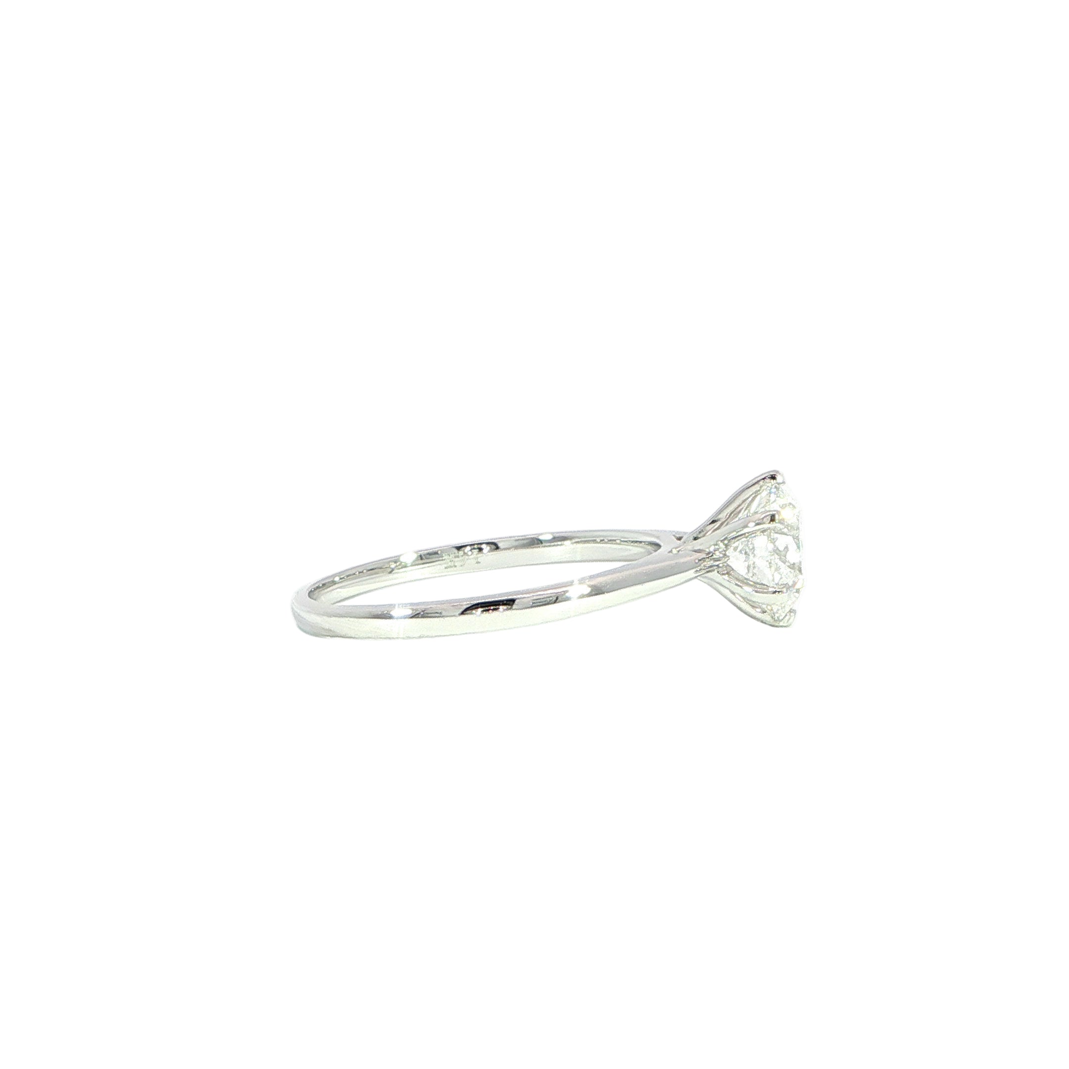 Side white gold solitaire ring with round brilliant diamond