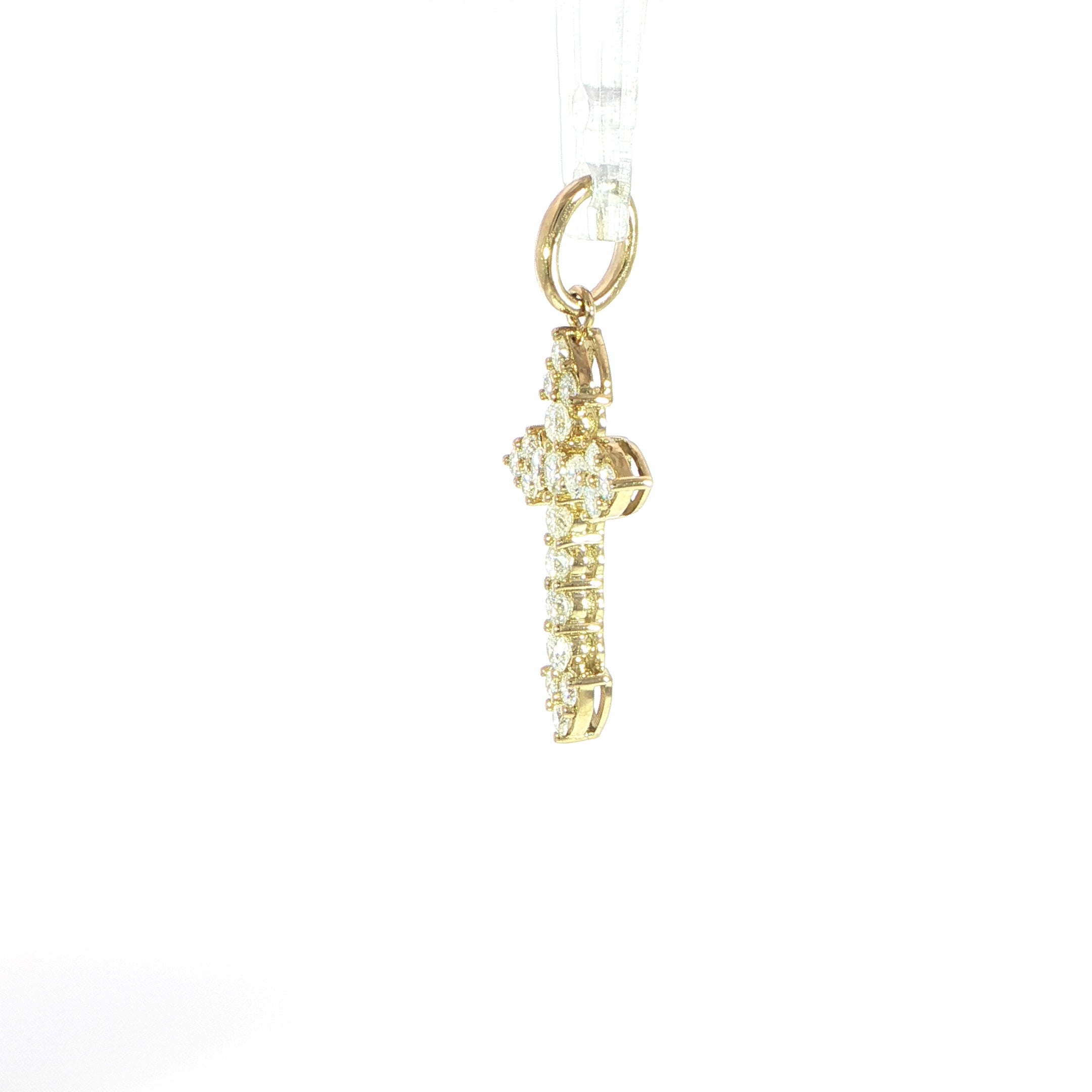 Small gold cross pendant featuring natural diamond accents