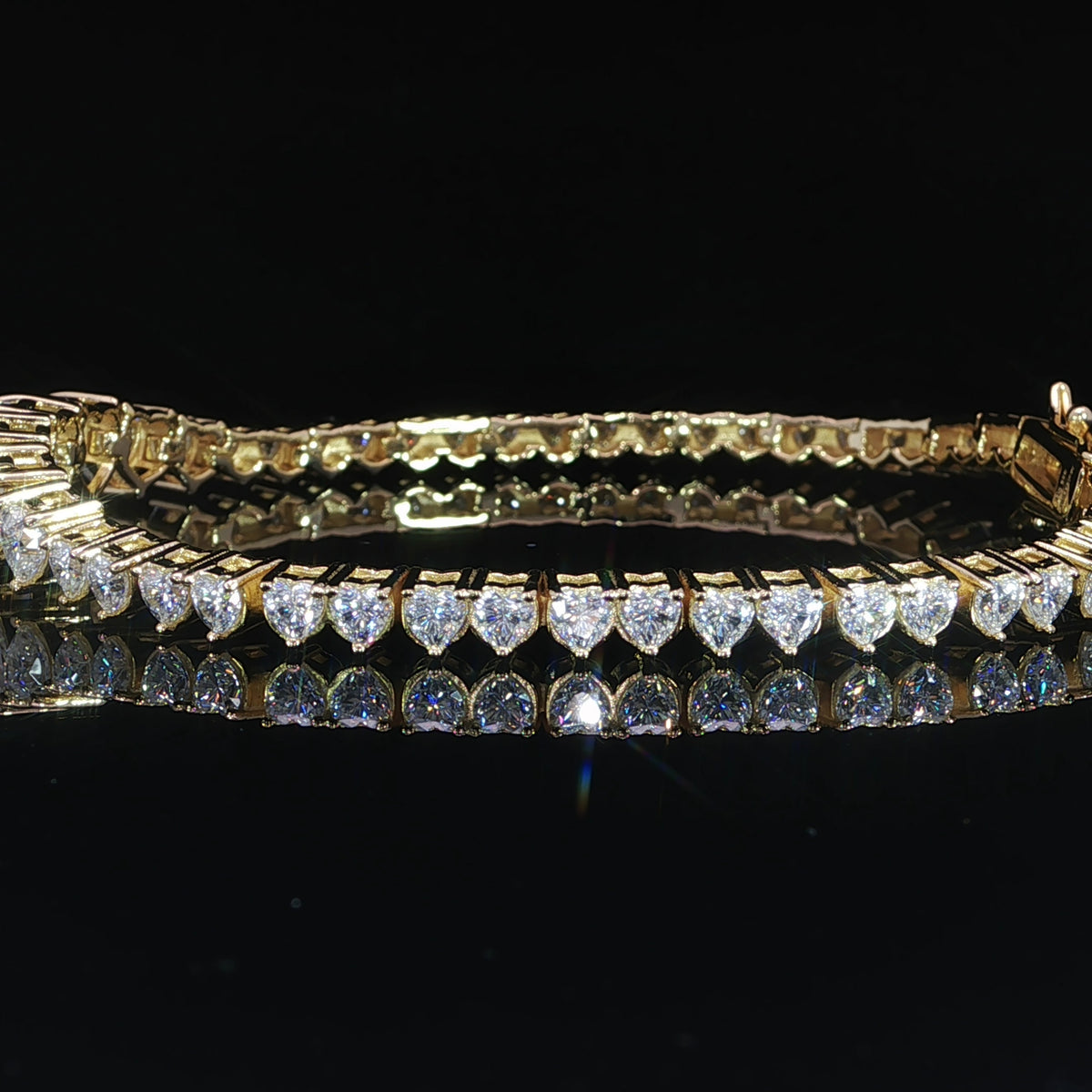 Women’s sterling silver graduated heart moissanite tennis bracelet side profile