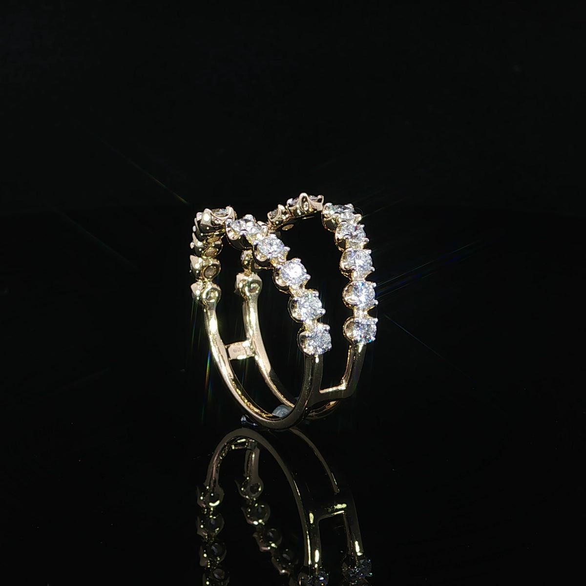 Three-quarter view of a 14K yellow gold ring enhancer with graduated lab-grown diamonds totaling 0.96 carats.