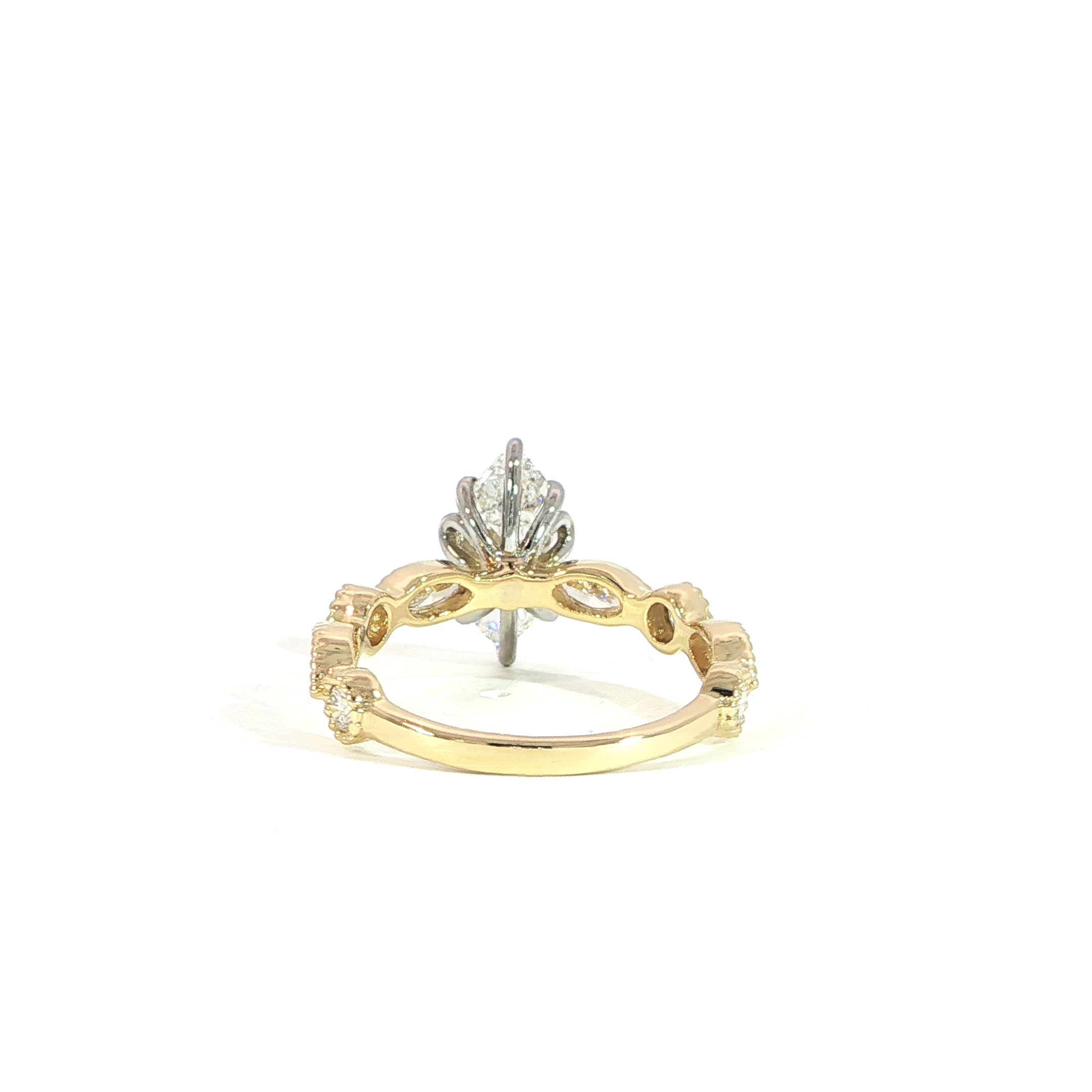 Yellow gold marquise engagement ring with accent diamonds back view