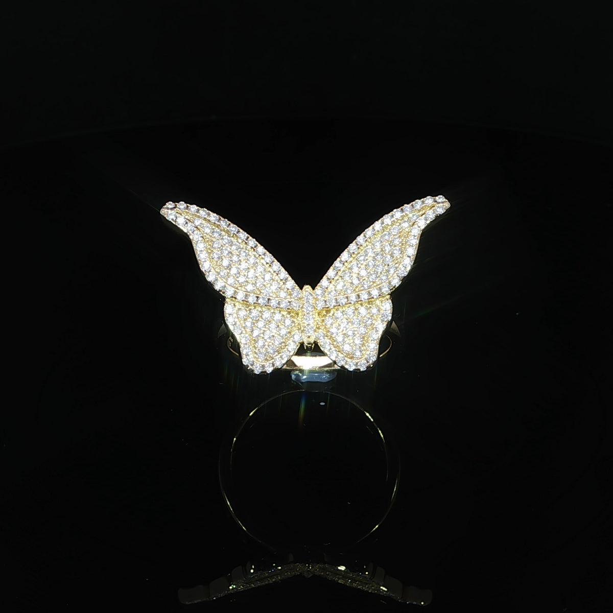 Angled view of a VVS moissanite butterfly ring